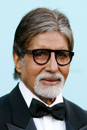 A veteran Indian film performer in a modest dressing room, study script in hand, mirror lights glowing, calm and workmanlike mood, documentary style